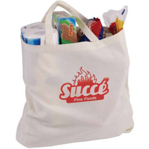 A cream-coloured calico bag with a gusset, filled with various grocery items, featuring a logo.