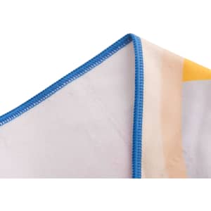 A microfibre beach towel with a vibrant design featuring yellow and pastel colours, edged in blue stitching.