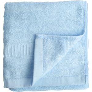 A folded, soft blue bamboo fiber towel, featuring a textured edge and a logo on one corner.