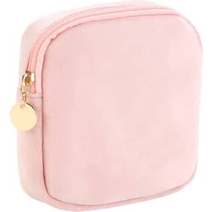 A stylish mini makeup bag in soft pink with a zip closure and a gold-toned charm.
