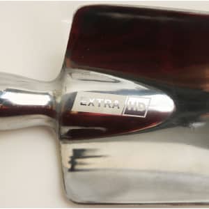 A shiny metal garden spade with a reflective surface and a sturdy handle. It features a logo on the blade.