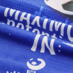 A blue sports towel featuring a design with text and a logo, made for leisure and gym use.