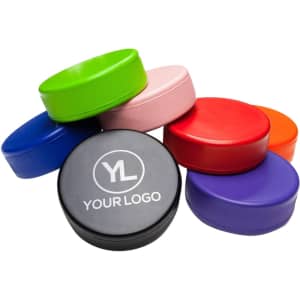 A vibrant collection of eight hockey puck-shaped stress relievers in various colours, featuring one with a logo.