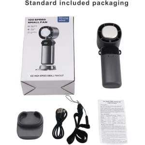 A portable cooling fan in grey with a phone stand, USB cable, and manual inside its packaging.