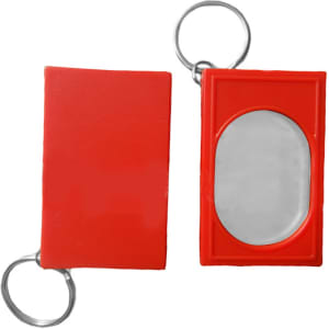 A red training clicker with a keyring attachment, featuring a shiny metal click surface.