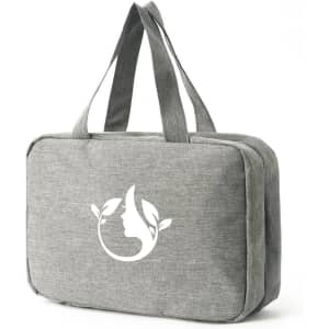 A large grey toiletry bag with two handles and a logo featuring nature-themed elements.