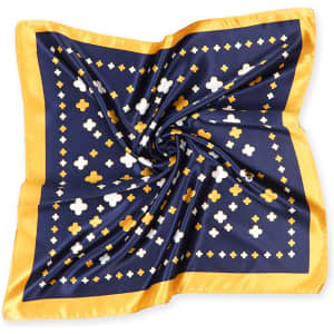 A navy blue silk satin scarf with a patterned design featuring white and gold shapes and a gold border.