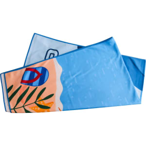 A microfibre beach towel in blue featuring tropical designs and patterns, with a logo on it.
