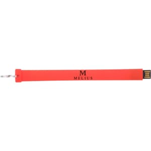 A red silicone flash drive with a keyring attachment and a logo.