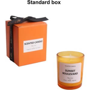 A 3.5oz glass scented candle in a vibrant orange box, featuring a label with "Sunset Boulevard."