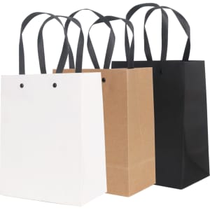 Three small vertical paper bags in white, kraft, and black, each with a knitted handle. Each bag has a logo.