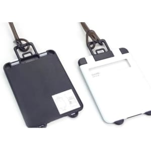 A pair of ABS luggage tags in black and white, featuring a clear window for personal information and a logo.