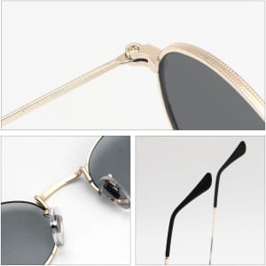 Oval retro sunglasses featuring gold frames and dark lenses, with black temple tips and a small logo on the side.