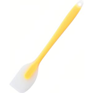 A silicone spatula with a yellow handle and a white spatula head. It features a hole for hanging.
