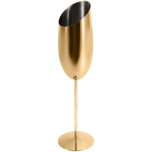 A stainless steel slanted champagne flute in a shiny gold finish, featuring a round base and sleek design.