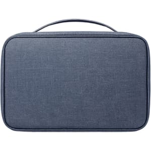 A portable hanging travel toiletry bag in a blue fabric, featuring a sturdy handle and a rectangular shape.