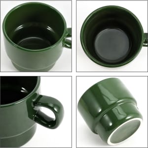 A stackable ceramic mug in dark green, featuring a smooth finish and a curved handle, with a hollow interior.