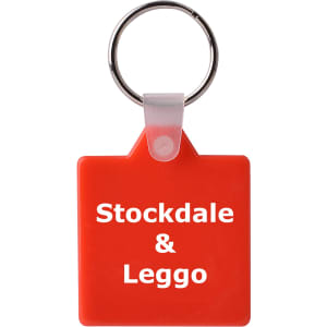 A square red hard plastic keyring with a metallic keyring attachment. It features a logo on one side.