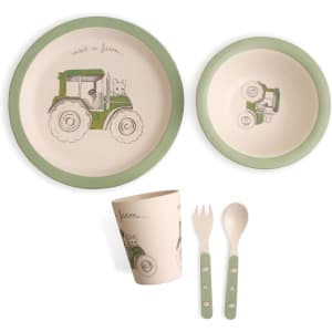 Bamboo fibre tableware set in cream with green trim, featuring a tractor design. Includes a bowl, plate, cup, and utensils.