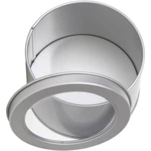 A medium silver tin can with a transparent window, featuring a removable lid. Ideal for packaging.