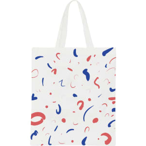 A cotton bag features a white background with colourful abstract shapes in red and blue, and short handles.