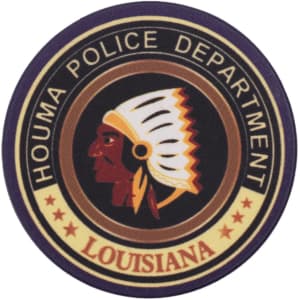 A circular patch featuring a profile of a Native American chief, with text around it indicating the Houma Police Department, Louisiana.