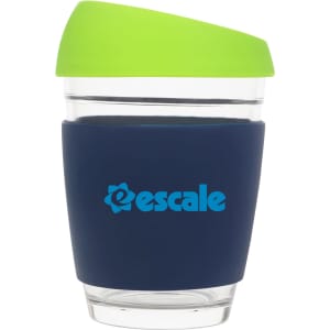 A drink bottle featuring a clear glass body with a navy silicone sleeve and a green lid, along with a logo.
