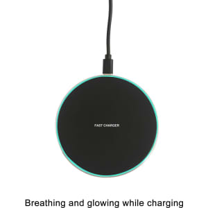 A round, black wireless charger with a glowing edge, connected to a power source. It features a logo.