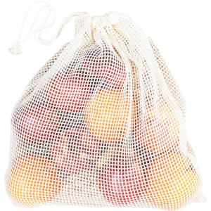 A white organic cotton mesh bag filled with vibrant apples in various colours. The bag has a drawstring closure and a logo.