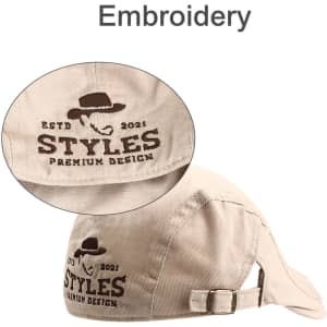 A beige beret hat featuring an embroidered logo and an adjustable strap at the back.