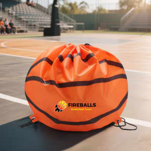 An orange ball-shaped drawstring backpack with black lines and a logo, set on a basketball court.