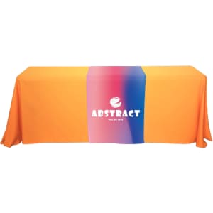 An orange table runner with a gradient centre featuring a logo. Suitable for displaying on a table at an event.