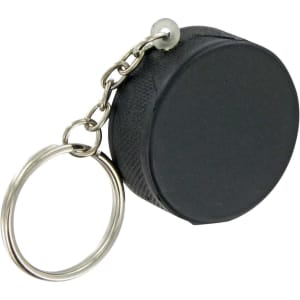 A black hockey puck stress reliever attached to a keyring with a silver chain.