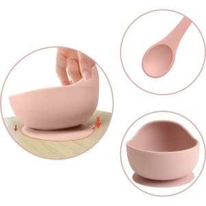 A pink silicone suction bowl with a matching spoon, featuring a suction base for stability.
