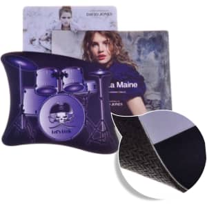 A purple mouse mat featuring a drum set design and textured underside, with additional promotional materials behind it.