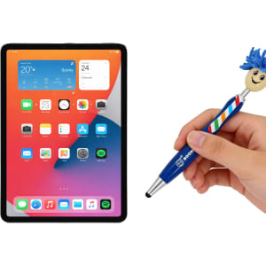 A blue and white striped pen with a mop-top design, held next to a tablet displaying a colourful screen.