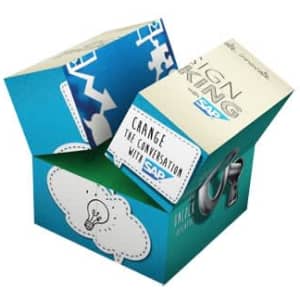 A promotional cube in blue and green with geometric designs and a logo, depicting various conversational elements.