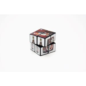 A 2x2 Rubik's Cube in black featuring images of drinks on its sides.