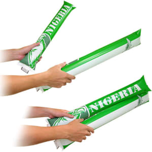 A pair of green and white cheering bang bang sticks with a logo, held in hands, ready for use.