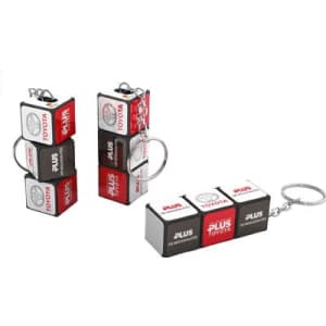 A Rubik's Block keyring in black and white, featuring a logo and connected by a metal chain.