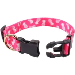 A pink dog collar featuring a white pineapple pattern, with a black buckle and metal D-ring for leash attachment.
