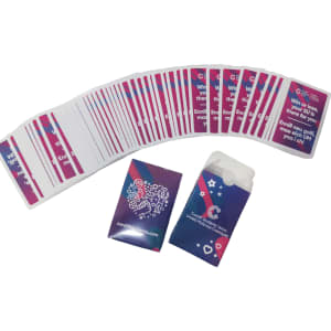 A set of playing cards with a colourful design, accompanied by a matching paper box. Both feature a logo.