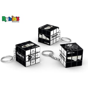 A Rubik's Cube 3x3 keychain in black and white, featuring three cubes on keyrings with a logo present.