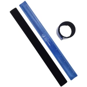 A reflective snap wristband in black, a blue ruler, and a blue tape roll arranged together.