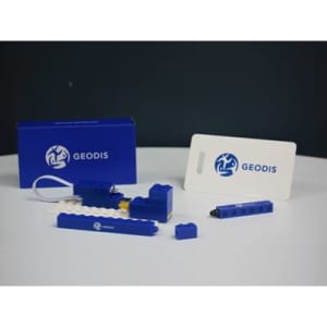 A blue travel set including a pen, luggage tag, and a holder, presented in a matching blue box.