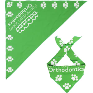 A green bandana featuring white paw prints, with a smaller bandana tied to it. It includes a logo.