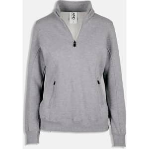 A light grey women's half-zip fleece jumper with side pockets and a collar, featuring a logo.