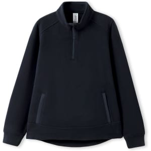 A dark navy women's polar fleece half zip top featuring a collar and side pockets. It has a small logo.