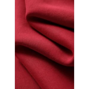 A red fleece fabric showcasing soft, textured folds, suitable for jumpers. Features a logo present on the fabric.