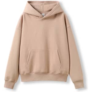 A beige oversized hoodie featuring a front pocket and an attached hood, displaying a simple design.